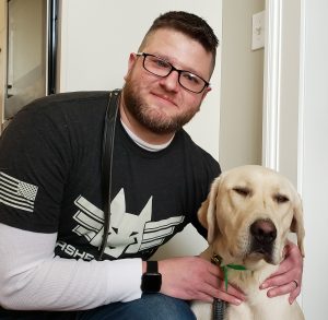 Rob, an Army veteran, with his service dog, Monsoon.